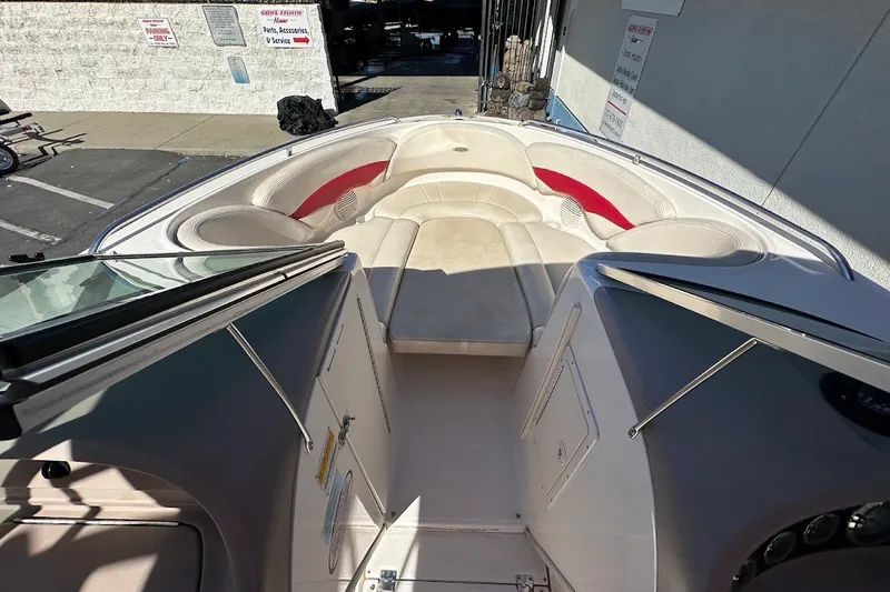 Slide: The Image of Interior view of a 2000 Chaparral 216 SSi boat, featuring spacious seating and sleek design. - 27