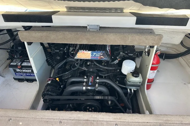 Slide: The Image of Engine compartment of a 2000 Chaparral 216 SSi boat, featuring a 5.7-liter engine. - 31