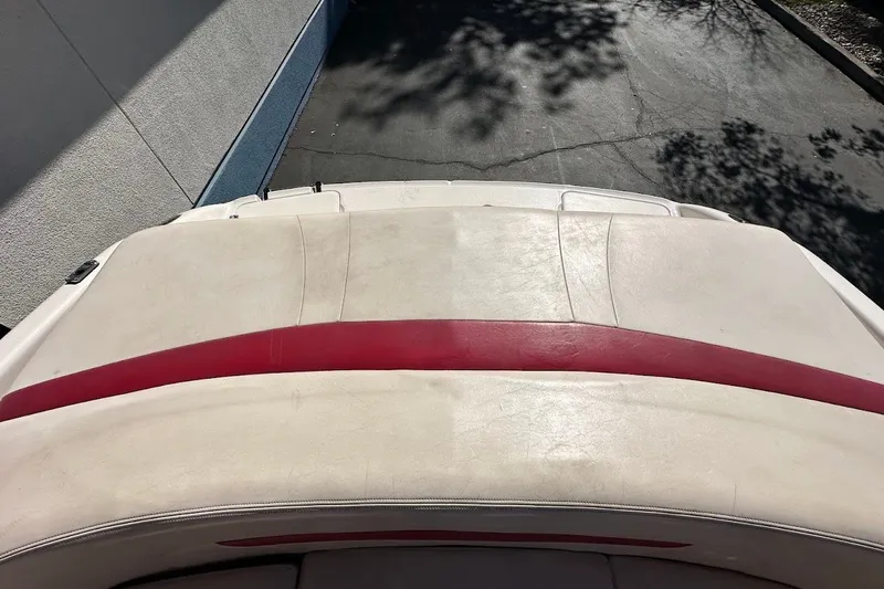 Slide: The Image of Rear view of a 2000 Chaparral 216 SSi boat with red and white upholstery. - 19