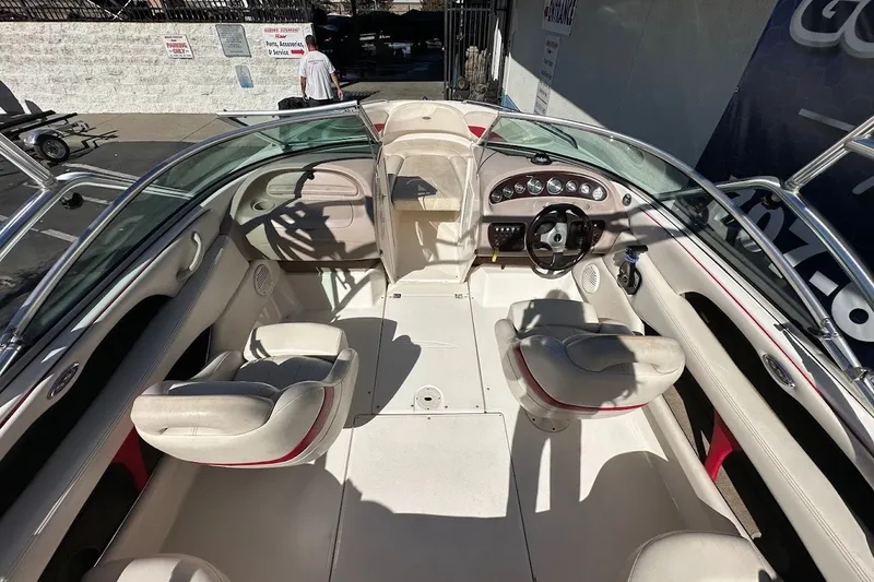 Slide: The Image of Interior view of a 2000 Chaparral 216 SSi boat with seating and dashboard. - 12