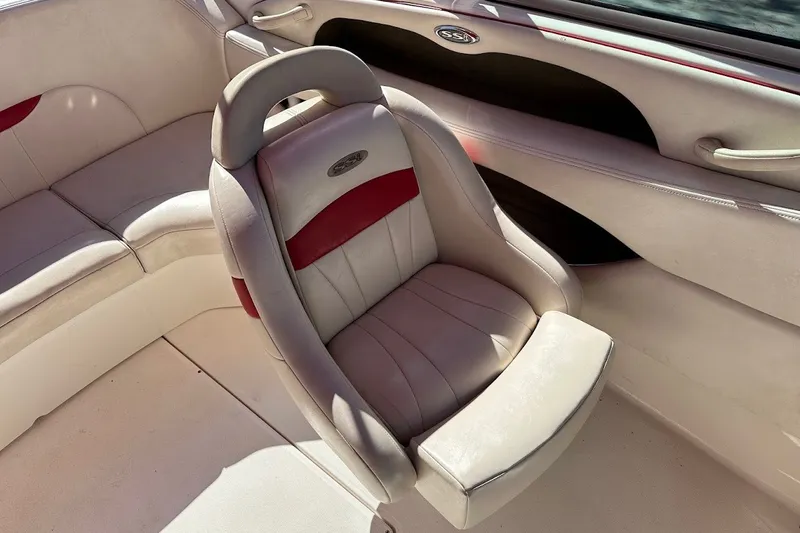 Slide: The Image of 2000 Chaparral 216 SSi boat interior with plush seating and elegant design. - 17