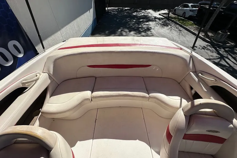 Slide: The Image of Interior of a 2000 Chaparral 216 SSi boat with beige and red seating. - 18