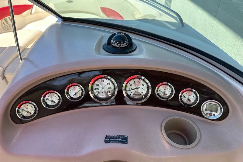 Slide: The Image of Dashboard of a 2000 Chaparral 216 SSi boat with gauges and compass. - 24