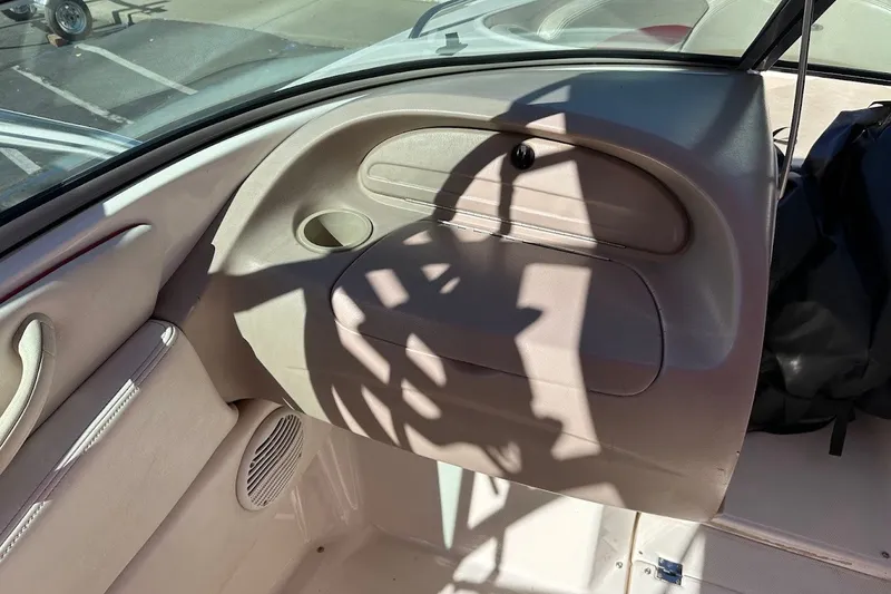 Slide: The Image of Interior view of a 2000 Chaparral 216 SSi boat, showing dashboard details. - 15