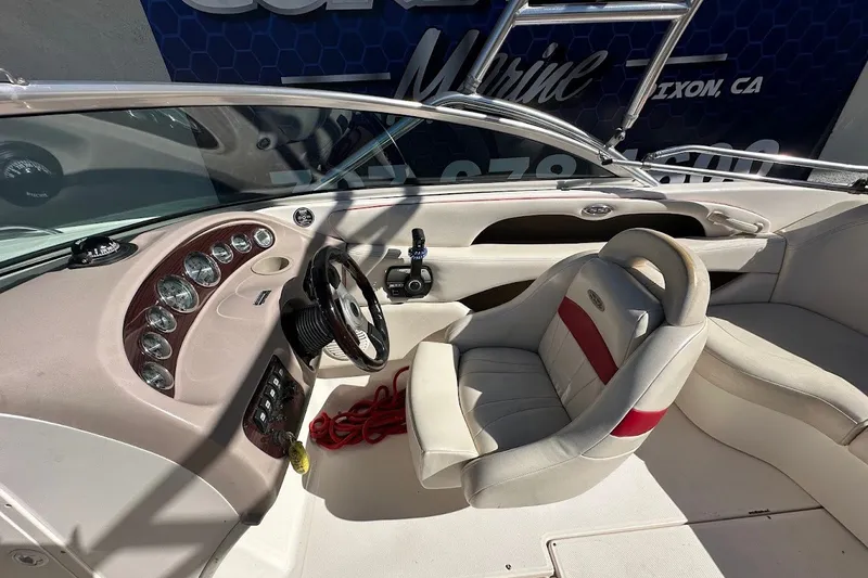 Slide: The Image of Interior of a 2000 Chaparral 216 SSi boat with steering wheel and dashboard. - 20
