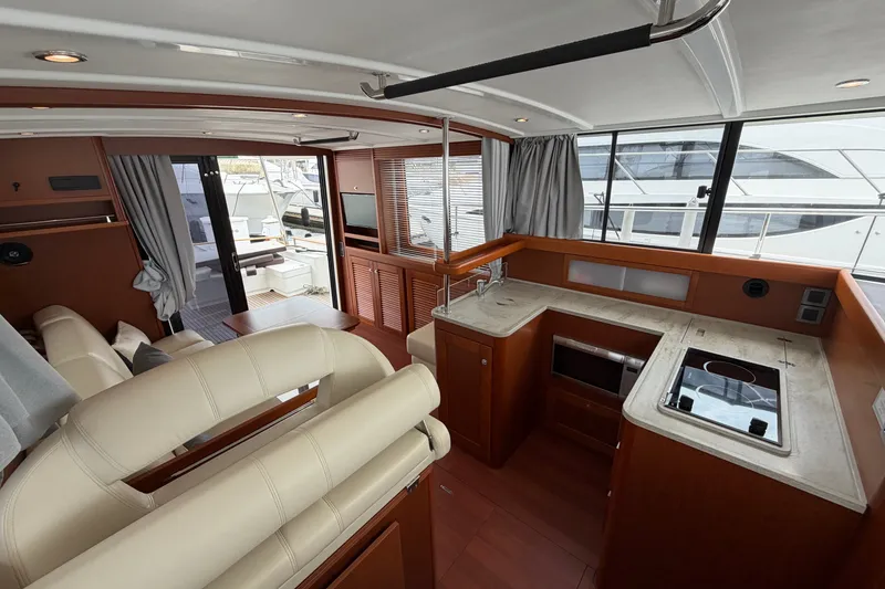 Slide: The Image of Interior of 2019 Beneteau Swift Trawler 44 with modern kitchen and seating area. - 22