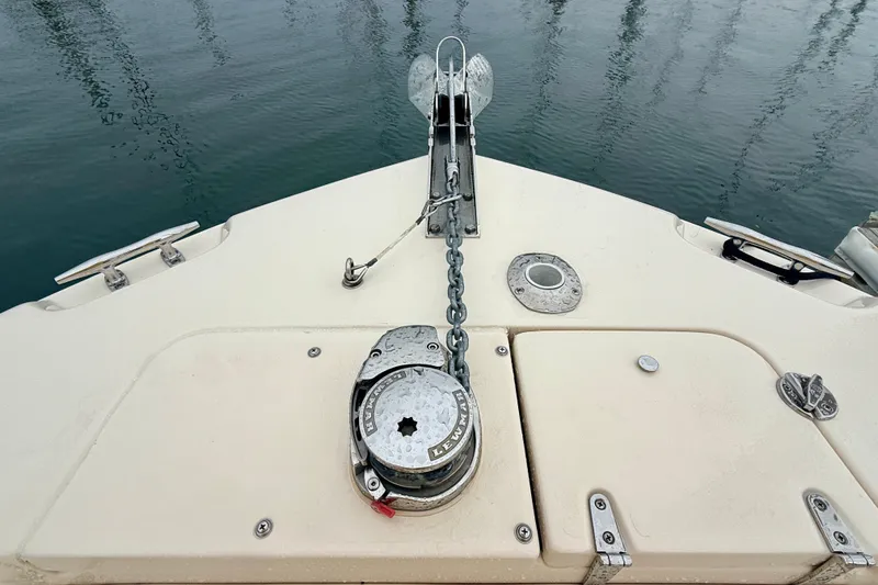 Slide: The Image of Bow of 2025 Grady-White Fisherman 257 with anchor and chain mechanism. - 26