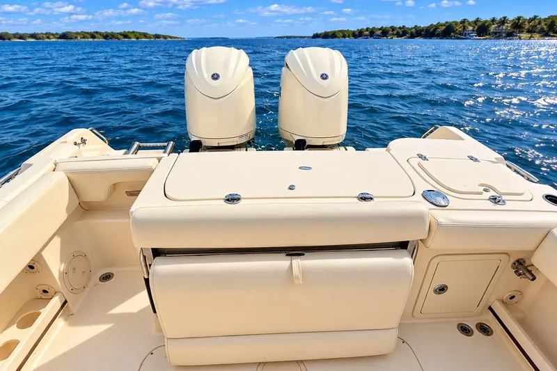 Slide: The Image of 2025 Grady-White Fisherman 257 boat with dual engines on open water. - 4
