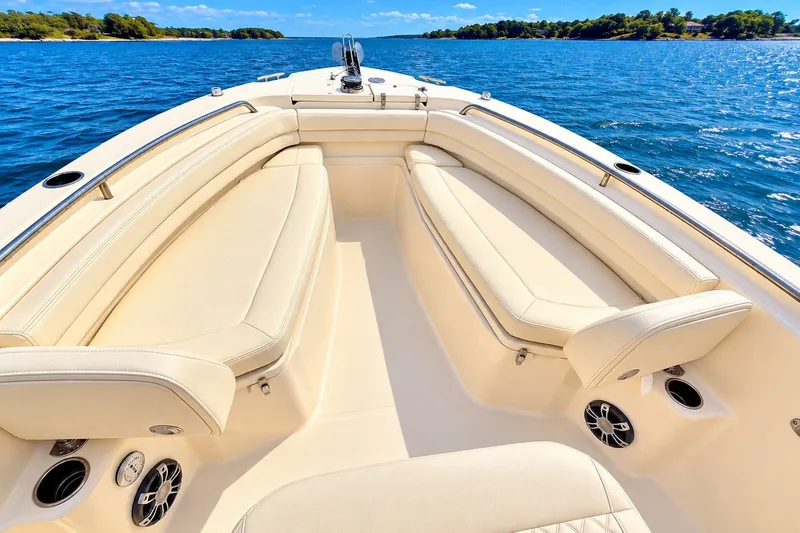 Slide: The Image of 2025 Grady-White Fisherman 257 boat interior with luxurious seating on a sunny day. - 18