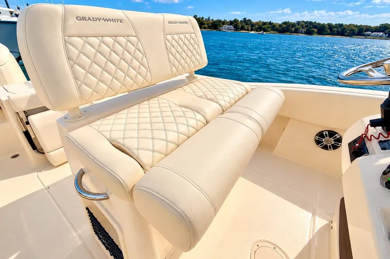 Slide: The Image of Luxurious seating on 2025 Grady-White Fisherman 257 boat, with scenic water view. - 14