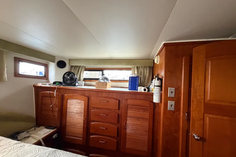 Slide: The Image of 1989 Californian Aft Cabin interior with wooden cabinetry and modern amenities. - 40