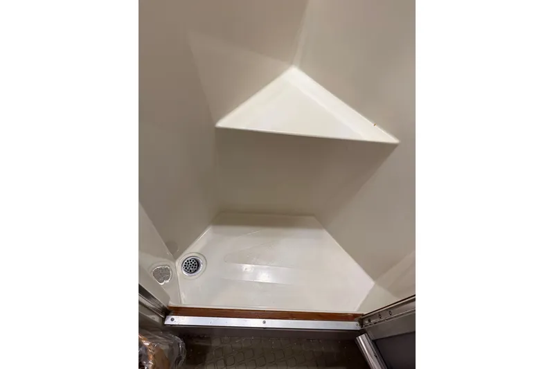 Slide: The Image of Shower area in 1989 Californian Aft Cabin boat with corner seat and drain. - 47