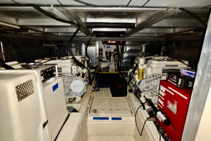 Slide: The Image of Engine room of a 1989 Californian Aft Cabin yacht, showcasing machinery and equipment. - 17