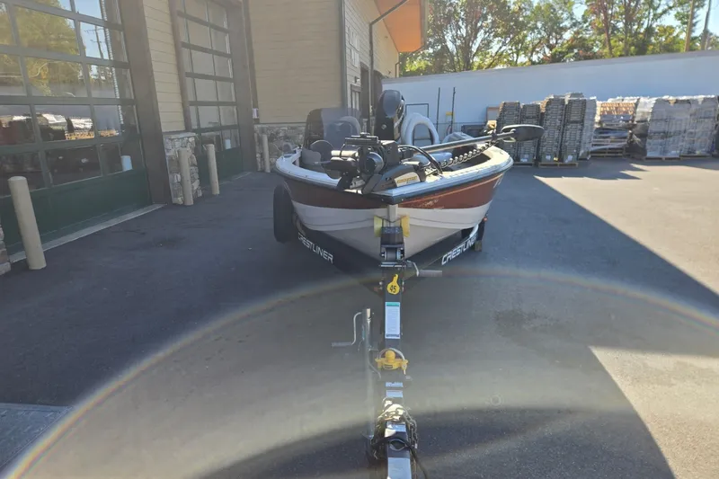 Slide: The Image of 2008 Crestliner 1850 Fish Hawk SC boat on trailer in outdoor setting. - 4