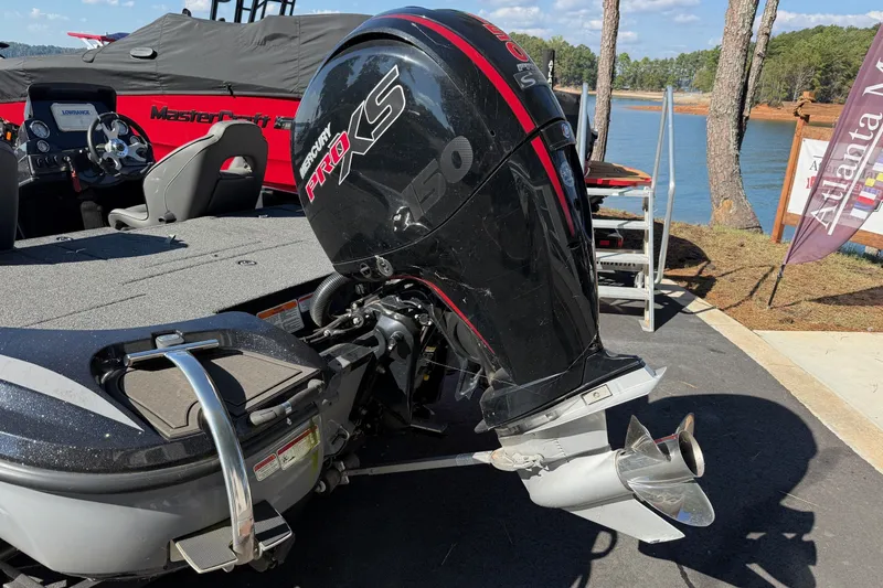 Slide: The Image of 2024 Nitro Z18 boat with Mercury Pro XS engine by a lakeside. - 3
