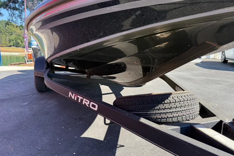 Slide: The Image of 2024 Nitro Z18 boat on trailer, showcasing sleek hull design. - 4