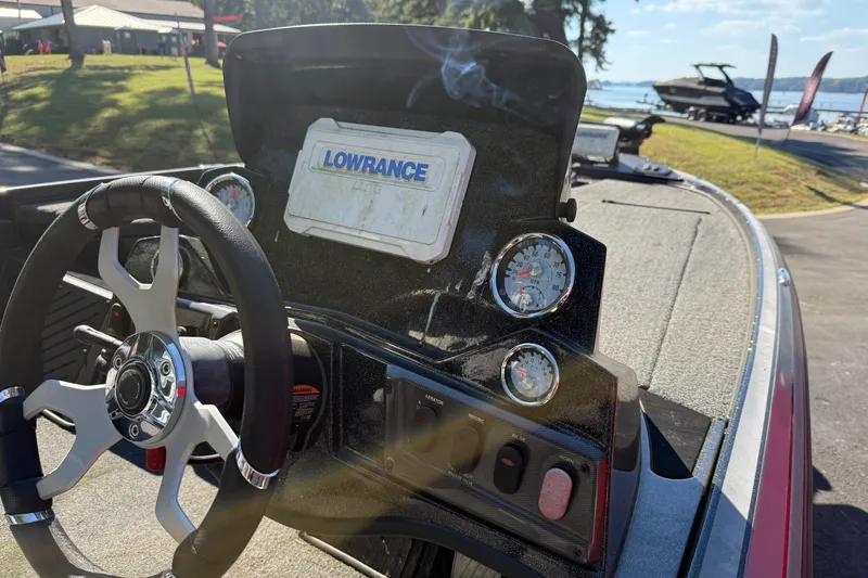 Slide: The Image of 2024 Nitro Z18 boat dashboard with steering wheel and Lowrance display. - 8