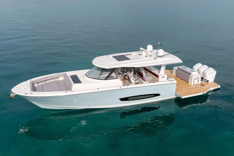 Slide: The Image of Manufacturer Provided Image: 2026 Regal 50 SAV luxury yacht on calm blue water, showcasing sleek design and modern features. - 1