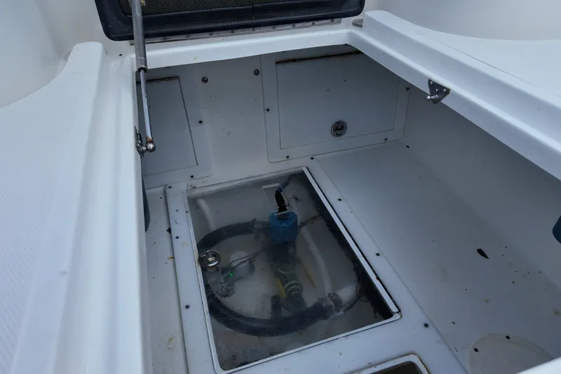Slide: The Image of Open storage compartment in 2017 SeaHunter 41 Tournament boat, showing internal components and wiring. - 28