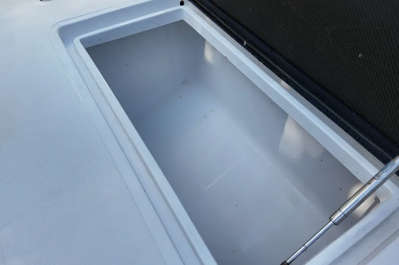 Slide: The Image of Open storage compartment on 2017 SeaHunter 41 Tournament boat. - 30
