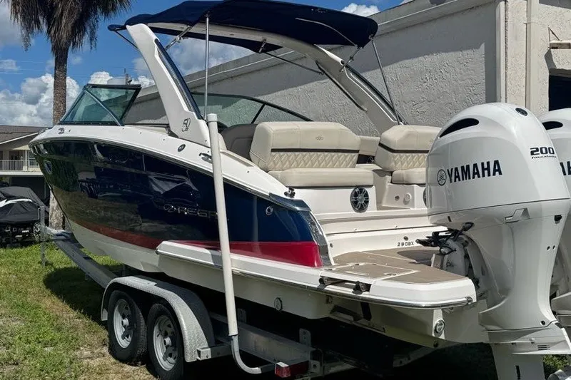 Slide: The Image of 2021 Regal 29 OBX boat with Yamaha 200 engine on trailer, parked outdoors. - 3