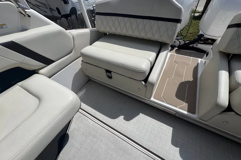 Slide: The Image of Interior seating of a 2021 Regal 29 OBX boat with cushioned upholstery. - 25