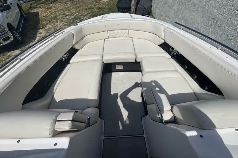 Slide: The Image of 2021 Regal 29 OBX boat interior with spacious white seating and modern design. - 6