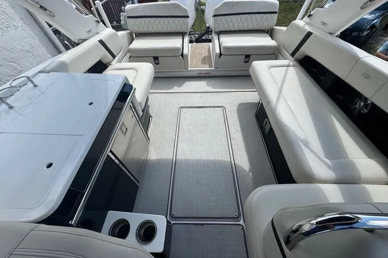 Slide: The Image of Luxurious interior of a 2021 Regal 29 OBX boat with plush seating and modern amenities. - 23