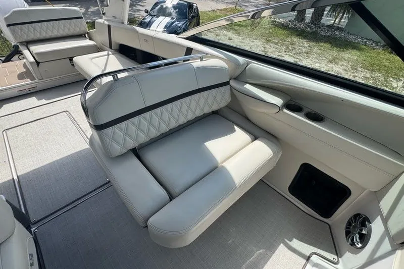 Slide: The Image of 2021 Regal 29 OBX boat interior with luxurious seating and modern design. - 16