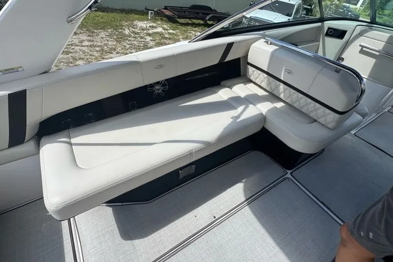 Slide: The Image of 2021 Regal 29 OBX boat interior with luxurious white seating and modern design. - 15