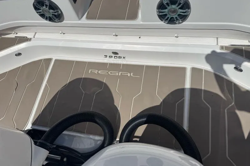 Slide: The Image of 2021 Regal 29 OBX boat deck with speakers and stylish flooring. - 28