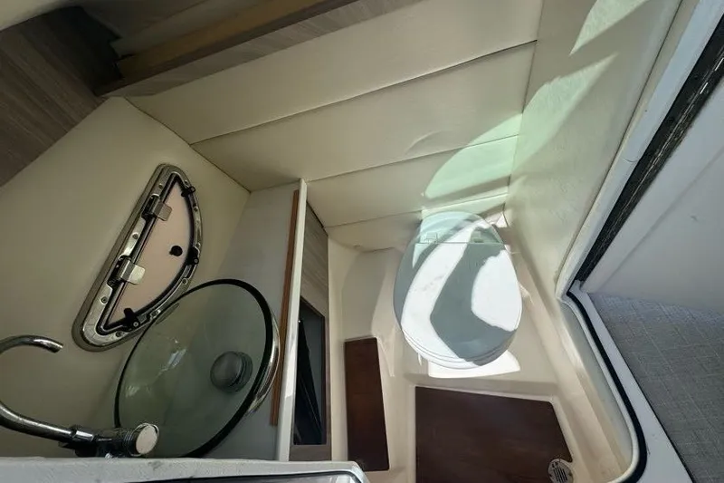 Slide: The Image of 2021 Regal 29 OBX boat bathroom with modern sink and compact toilet. - 17