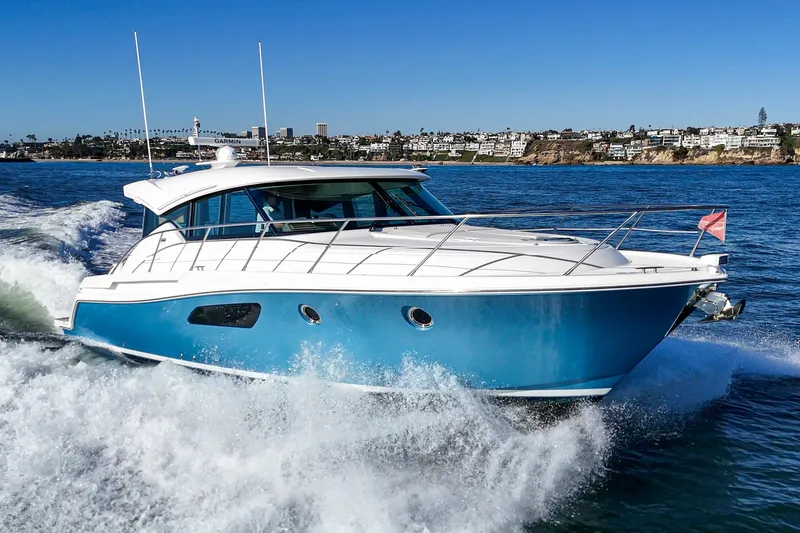 Slide: The Image of 2021 Tiara C 44 Coup yacht cruising on blue ocean waters. - 70