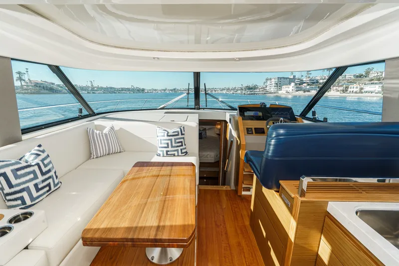 Slide: The Image of Luxurious interior of 2021 Tiara C 44 Coup yacht with elegant seating and scenic views. - 14