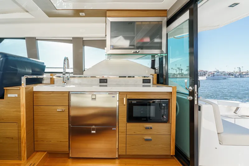 Slide: The Image of Modern kitchen interior on 2021 Tiara C 44 Coup yacht with ocean view. - 17
