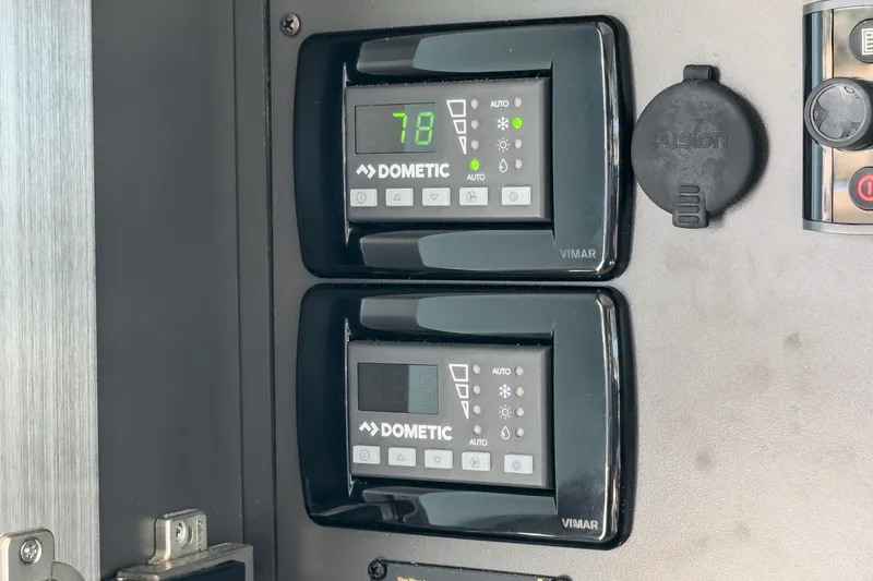 Slide: The Image of Digital control panels on a 2021 Tiara C 44 Coup yacht. - 28
