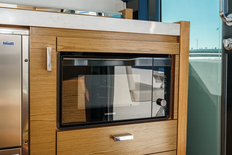 Slide: The Image of Modern kitchen with Samsung microwave in 2021 Tiara C 44 Coup yacht. - 20