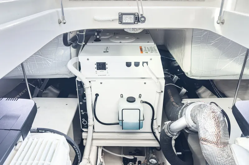 Slide: The Image of Engine compartment of a 2021 Tiara C 44 Coup yacht, showcasing mechanical components. - 48