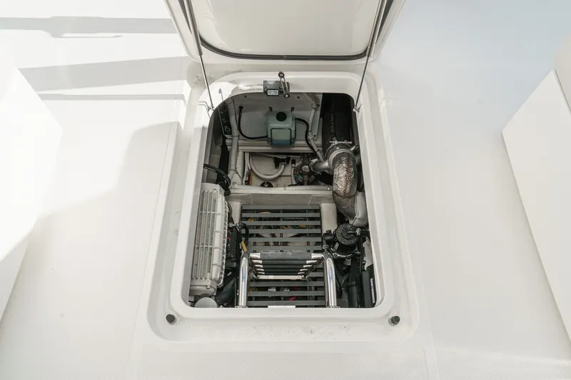 Slide: The Image of Engine compartment of a 2021 Tiara C 44 Coup yacht, showcasing mechanical components. - 45
