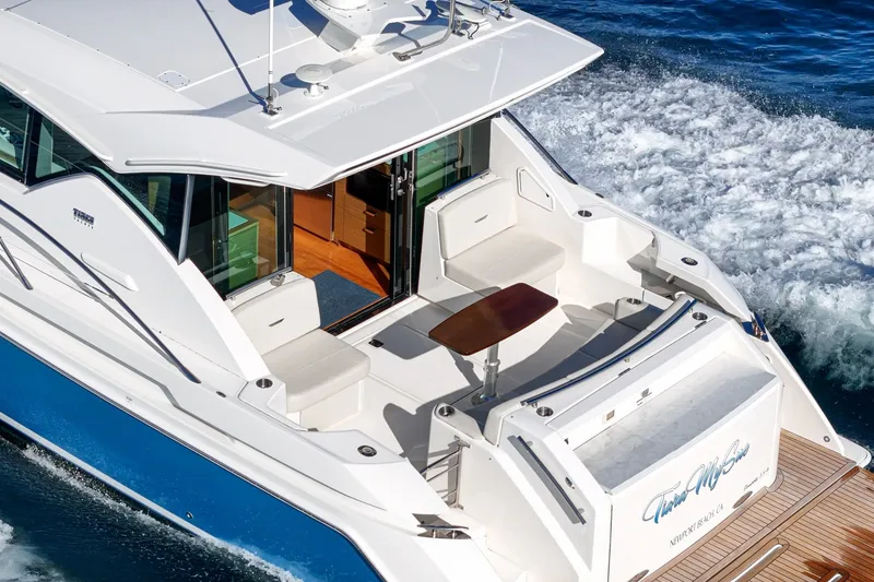 Slide: The Image of 2021 Tiara C 44 Coup yacht cruising on blue ocean waters. - 1