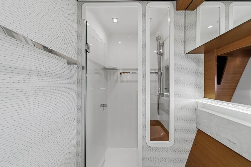 Slide: The Image of Modern bathroom interior of 2021 Tiara C 44 Coup yacht with sleek shower design. - 38