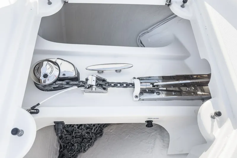 Slide: The Image of Anchor system of 2021 Tiara C 44 Coup yacht, featuring chain and winch. - 49