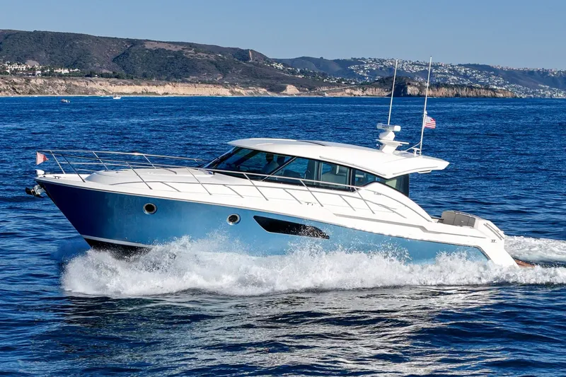 Slide: The Image of 2021 Tiara C 44 Coup yacht cruising on blue ocean waters. - 65