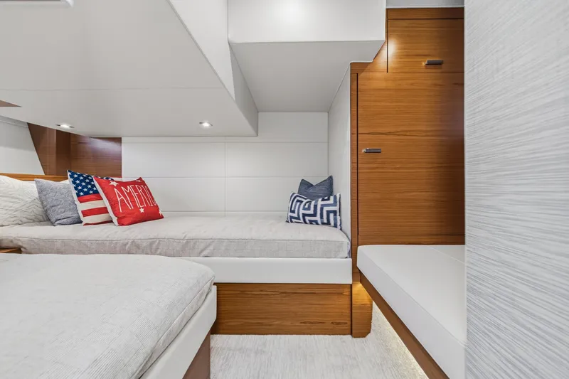 Slide: The Image of Interior of 2021 Tiara C 44 Coup yacht with cozy bedding and decorative pillows. - 42