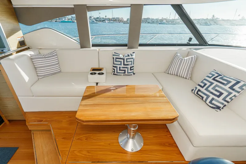 Slide: The Image of Luxurious interior of 2021 Tiara C 44 Coup yacht with elegant seating and nautical decor. - 15