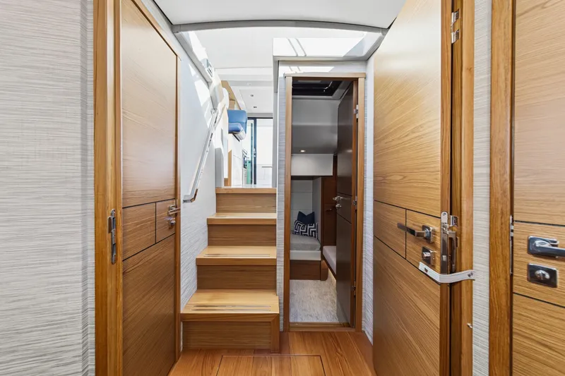 Slide: The Image of Interior of 2021 Tiara C 44 Coup yacht with wooden doors and stairs. - 39