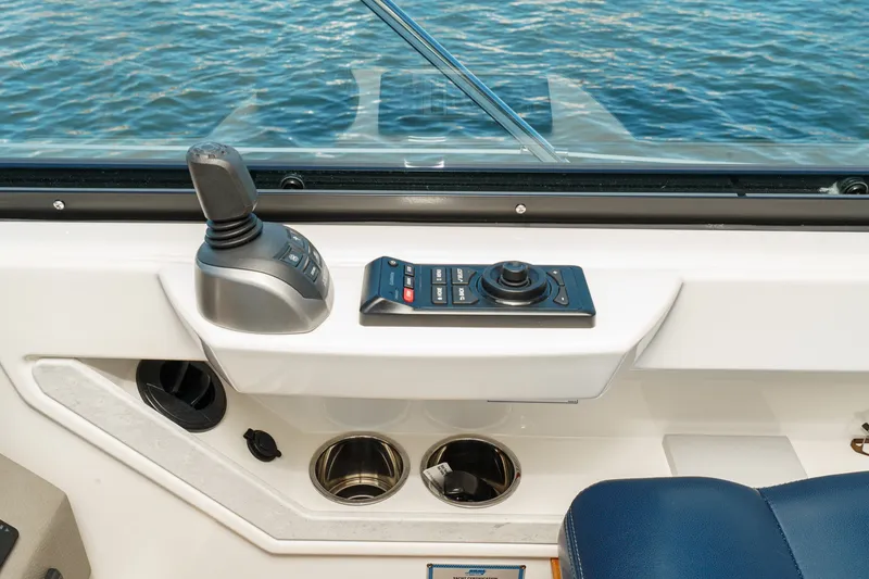 Slide: The Image of Control panel of a 2021 Tiara C 44 Coup boat with joystick and buttons. - 26