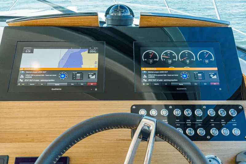 Slide: The Image of Dashboard of a 2021 Tiara C 44 Coup with Garmin navigation displays. - 25
