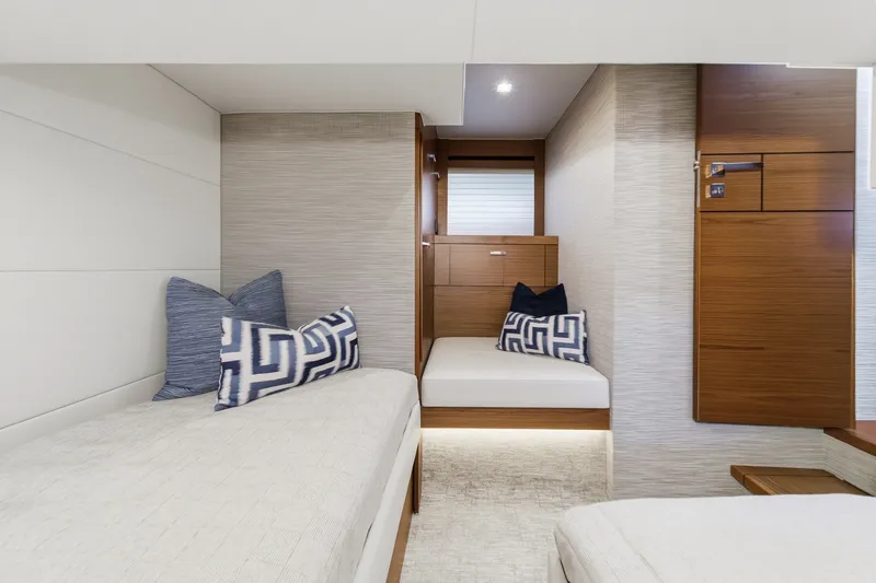Slide: The Image of 2021 Tiara C 44 Coup interior cabin with modern design and cozy bedding. - 44