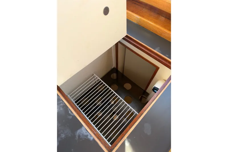 Slide: The Image of Interior view of a 1997 Covey Island Spencer Lincoln boat compartment with storage rack. - 17